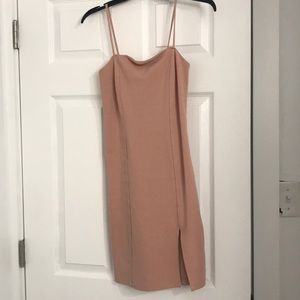 Knee length dress with slit.